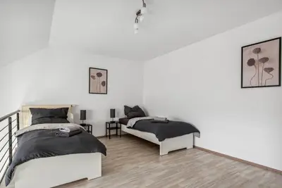 Ein Bett oder Betten in einem Zimmer der Unterkunft Galeriewohnung im Zentrum Worms!