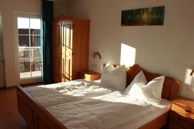 Ein Bett oder Betten in einem Zimmer der Unterkunft Pension Dorfengel