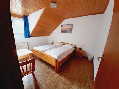 Ein Bett oder Betten in einem Zimmer der Unterkunft Pension Dorfengel