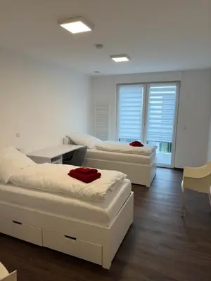 Ein Bett oder Betten in einem Zimmer der Unterkunft Barrierefreie Ferienwohnungen in der Nähe der Golf- und Freizeitanlage