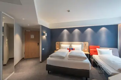 Ein Bett oder Betten in einem Zimmer der Unterkunft Holiday Inn Express Heilbronn by IHG