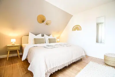 Ein Bett oder Betten in einem Zimmer der Unterkunft BOHO-Apartment - Feel like Home, Tiny Bathroom & Garage, 60m2