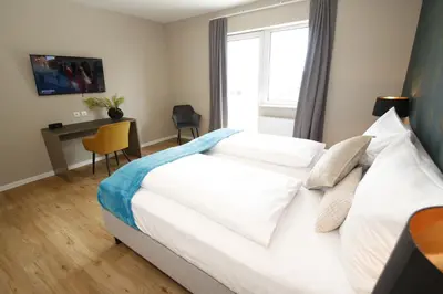 Ein Bett oder Betten in einem Zimmer der Unterkunft Amelie No 3 Hotel & Appartements