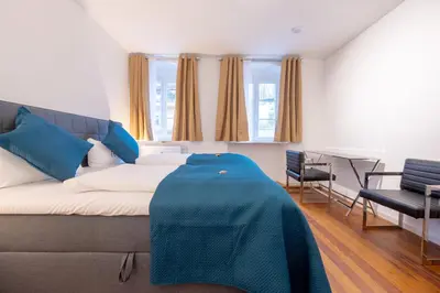 Ein Bett oder Betten in einem Zimmer der Unterkunft LIT LIVING Weinheim Altstadt - Boutique Apartments - Parking
