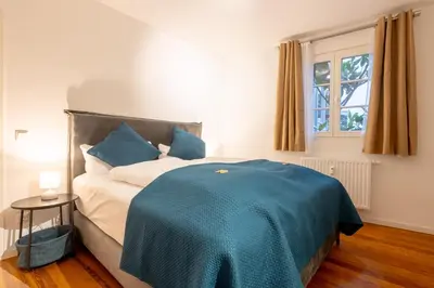 Ein Bett oder Betten in einem Zimmer der Unterkunft LIT LIVING Weinheim Altstadt - Boutique Apartments - Parking