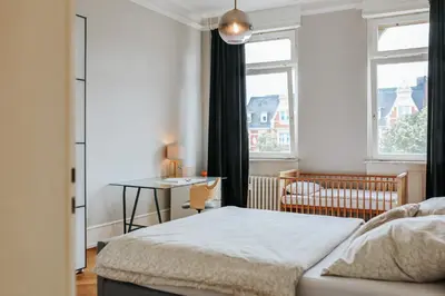Ein Bett oder Betten in einem Zimmer der Unterkunft namastay! Stilvoll Wohnen in Bestlage Mannheims - 3BR