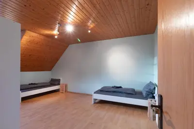 Ein Bett oder Betten in einem Zimmer der Unterkunft Traumhaus nähe Mainz I 12 Betten I 4 Schlafzimmer I Terrasse I 200m2 I Garten