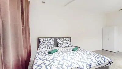 Ein Bett oder Betten in einem Zimmer der Unterkunft Garten Gästehaus