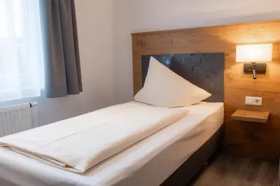 Ein Bett oder Betten in einem Zimmer der Unterkunft Hotel & Restaurant Bestenheider Stuben