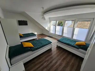 Ein Bett oder Betten in einem Zimmer der Unterkunft Ferienwohnung Eule