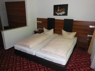 Ein Bett oder Betten in einem Zimmer der Unterkunft Landhotel Neding