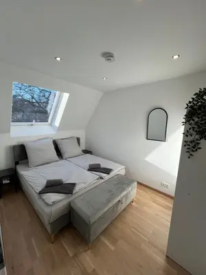 Ein Bett oder Betten in einem Zimmer der Unterkunft Moderne Wohnung Karlsruhe Neureut, Fußbodenheizung - Regendusche - Waschmaschine - Stellplatz