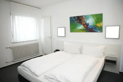 Ein Bett oder Betten in einem Zimmer der Unterkunft Weber Residenz