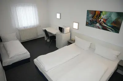 Ein Bett oder Betten in einem Zimmer der Unterkunft Weber Residenz