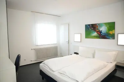 Ein Bett oder Betten in einem Zimmer der Unterkunft Weber Residenz
