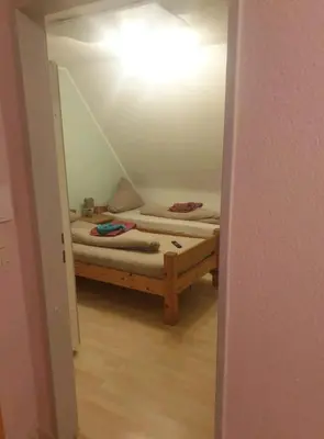 Ein Bett oder Betten in einem Zimmer der Unterkunft APARTMENT / WOHNUNG IN HAIBACH