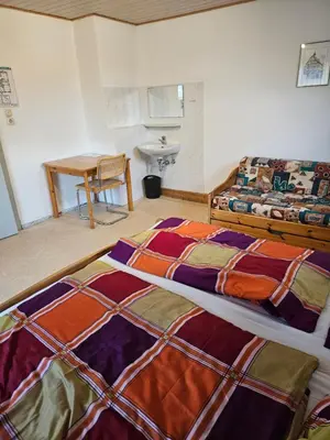 Ein Bett oder Betten in einem Zimmer der Unterkunft Naturfreundehaus