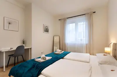 Ein Bett oder Betten in einem Zimmer der Unterkunft Rosenberg-Suites - Parkplatz, Zentral, Business & Privat