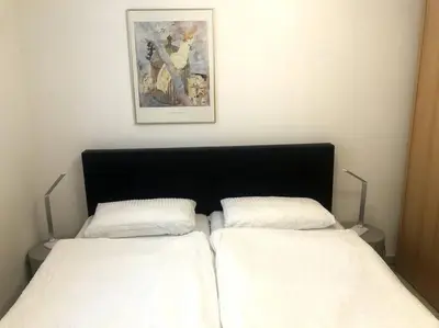 Ein Bett oder Betten in einem Zimmer der Unterkunft Wohnung in gehobener Lage