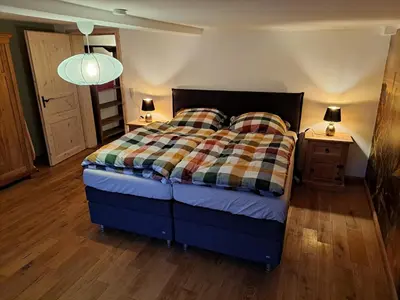 Ein Bett oder Betten in einem Zimmer der Unterkunft Gästehaus Merlin mit Saunabereich