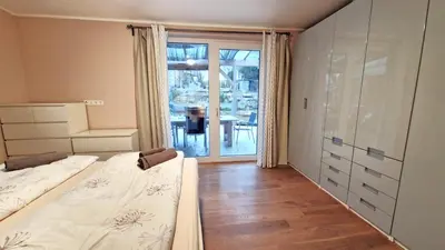 Ein Bett oder Betten in einem Zimmer der Unterkunft Wohnung mit Sauna, Garten & Schwimmteich