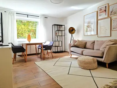 Ein Sitzbereich in der Unterkunft Magnolia: Moderne, voll möblierte Wohnung