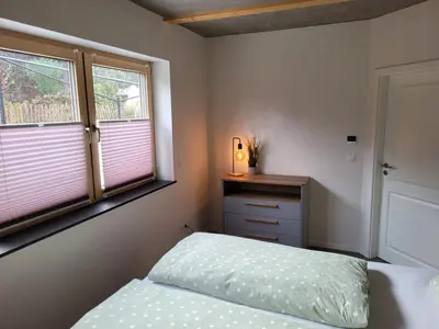 Ein Bett oder Betten in einem Zimmer der Unterkunft Wohnung unterm Burghalder - Direkt am Waldrand