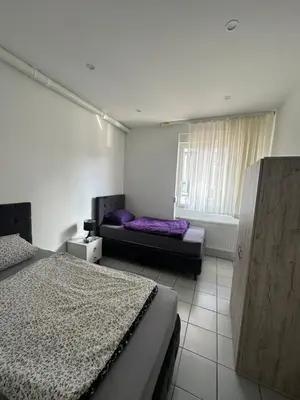 Ein Bett oder Betten in einem Zimmer der Unterkunft Heidelberg Apartments