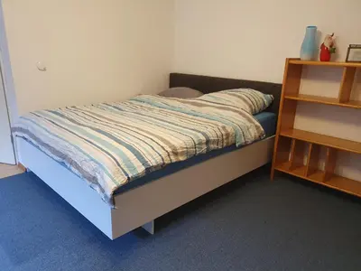 Ein Bett oder Betten in einem Zimmer der Unterkunft Ferienwohnung Tammer Allee