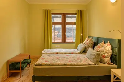 Ein Bett oder Betten in einem Zimmer der Unterkunft Gästehaus Villa Fliedner - Das Kutscherhaus