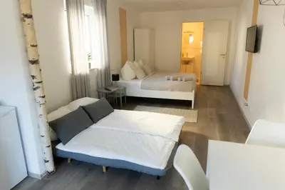 Ein Bett oder Betten in einem Zimmer der Unterkunft HUGOS Studio Apartment