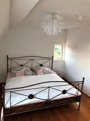 Ein Bett oder Betten in einem Zimmer der Unterkunft Ferienwohnung Zeitlos
