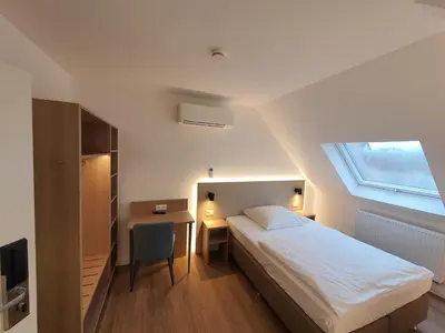 Ein Bett oder Betten in einem Zimmer der Unterkunft Hotel zur Traube