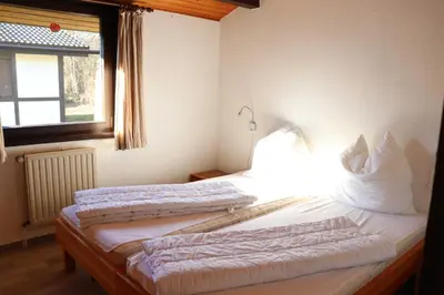 Ein Bett oder Betten in einem Zimmer der Unterkunft Ferienhaus Robinson Im Abendrot 123