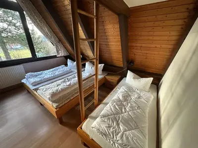 Ein Bett oder Betten in einem Zimmer der Unterkunft Ferienhaus Winnetou Am Fuchsbau 67