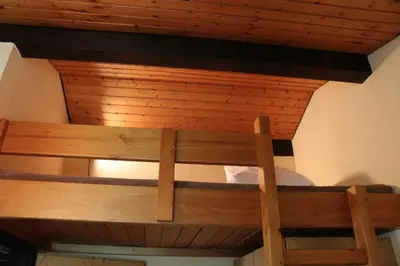 Ein Etagenbett oder Etagenbetten in einem Zimmer der Unterkunft Ferienhaus Robinson Sonnenkreisel 133