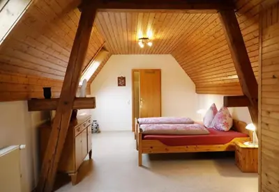 Ein Bett oder Betten in einem Zimmer der Unterkunft Gästezimmer Weingut Rösch