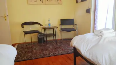 Ein Bett oder Betten in einem Zimmer der Unterkunft Zimmer mit zwei Einzelbetten