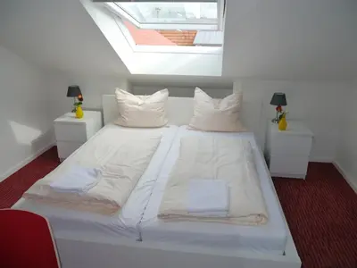 Ein Bett oder Betten in einem Zimmer der Unterkunft Mille Stelle Hotel