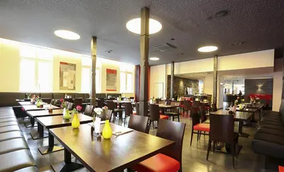 Ein Restaurant oder anderes Speiselokal in der Unterkunft Mille Stelle Hotel