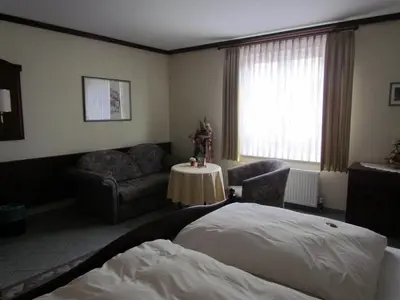 Ein Bett oder Betten in einem Zimmer der Unterkunft Hotel Zum Erker