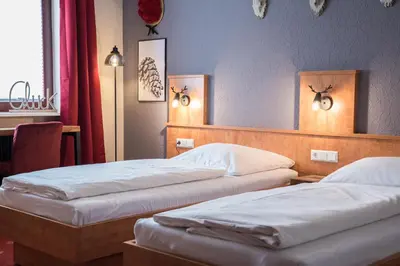 Ein Bett oder Betten in einem Zimmer der Unterkunft Landgasthof Zum Goldenen Anker