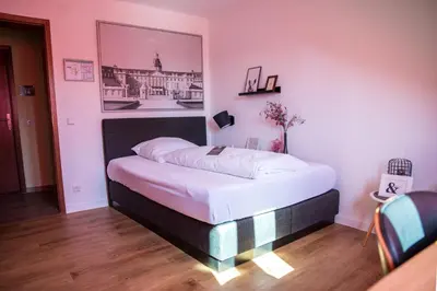 Ein Bett oder Betten in einem Zimmer der Unterkunft Landgasthof Zum Goldenen Anker