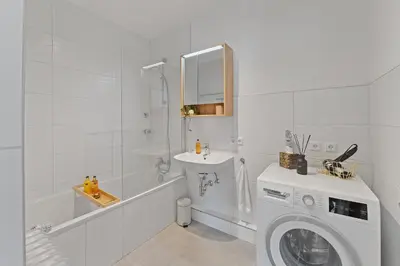 Ein Badezimmer in der Unterkunft Roomfall Apartment am Kurpark mit TG & Wifi & Balkon