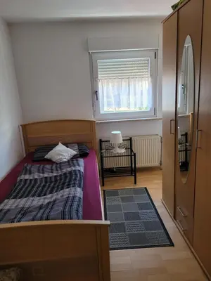 Ein Bett oder Betten in einem Zimmer der Unterkunft Ferienwohnung Fam.Lutz