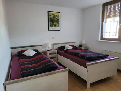 Ein Bett oder Betten in einem Zimmer der Unterkunft Ferienwohnung Fam.Lutz