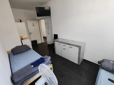 Ein Bett oder Betten in einem Zimmer der Unterkunft Nina Zimmer Zentral Bequem