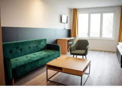 Ein Sitzbereich in der Unterkunft Hotel Central Vis a Vis