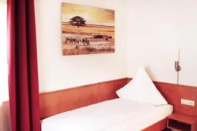 Ein Bett oder Betten in einem Zimmer der Unterkunft Hotel Pension Kaempfelbach