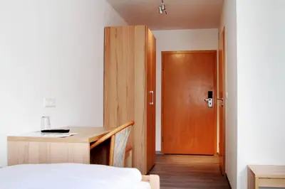 Ein Bett oder Betten in einem Zimmer der Unterkunft Hotel Pension Kaempfelbach